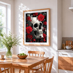 Monochrome skull with red roses cross stitch artwork displayed on wall as home decor