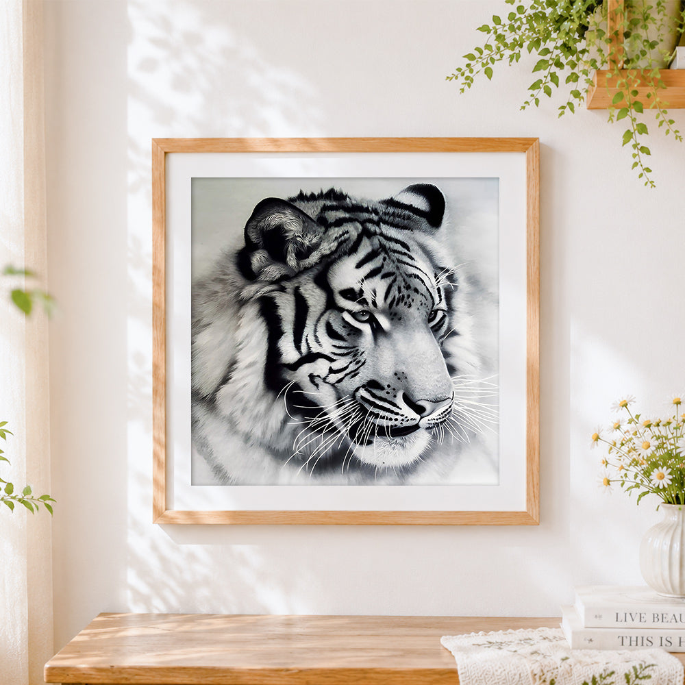 Finished monochrome white tiger portrait cross stitch artwork displayed