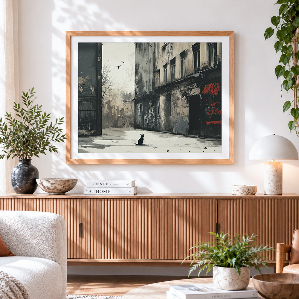 Finished moody monochrome street with cat cross stitch artwork displayed