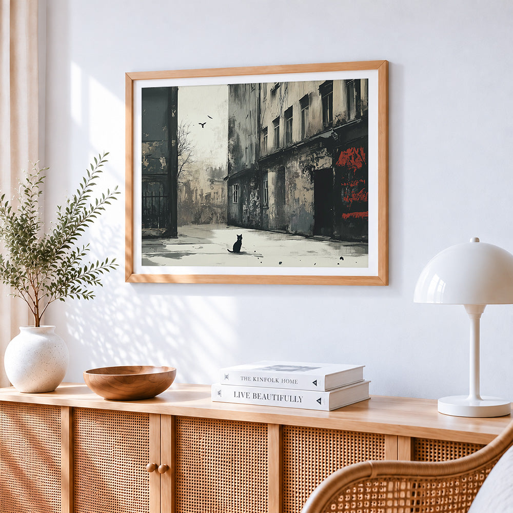 Moody monochrome street with cat cross stitch artwork displayed on wall as home decor