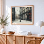 Moody monochrome street with cat cross stitch artwork displayed on wall as home decor