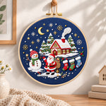 Moonlight christmas scene embroidery hoop wall art displayed as warm and cosy handmade home decor