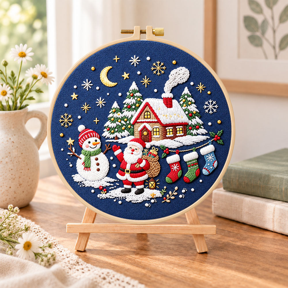 Moonlight christmas scene embroidery kit finished hoop displayed on a wooden stand as cosy tabletop decor