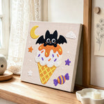 Moonlit bat ice cream punch needle artwork displayed on a table