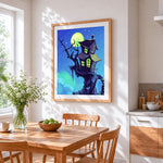 Moonlit haunted house cross stitch artwork displayed on wall as home decor