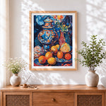 Finished moroccan pot and oranges cross stitch artwork displayed