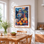 Moroccan pot and oranges cross stitch artwork displayed on wall as home decor
