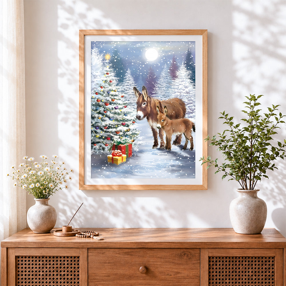 Finished mother and baby donkey with christmas tree cross stitch artwork displayed