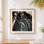 Finished motorcycle tyre close-up cross stitch artwork displayed