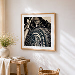 Motorcycle tyre close-up cross stitch artwork displayed on wall as home decor