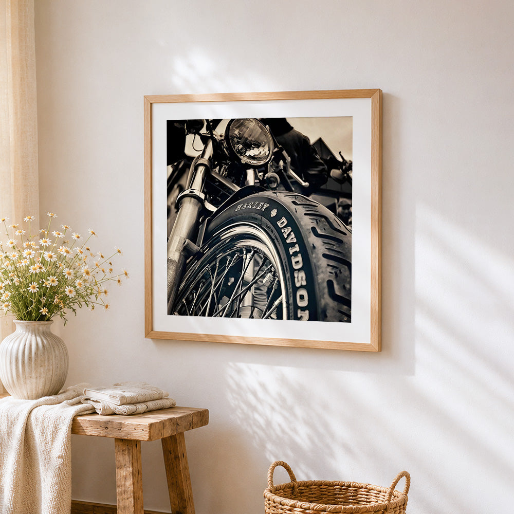 Motorcycle tyre close-up cross stitch artwork displayed on wall as home decor