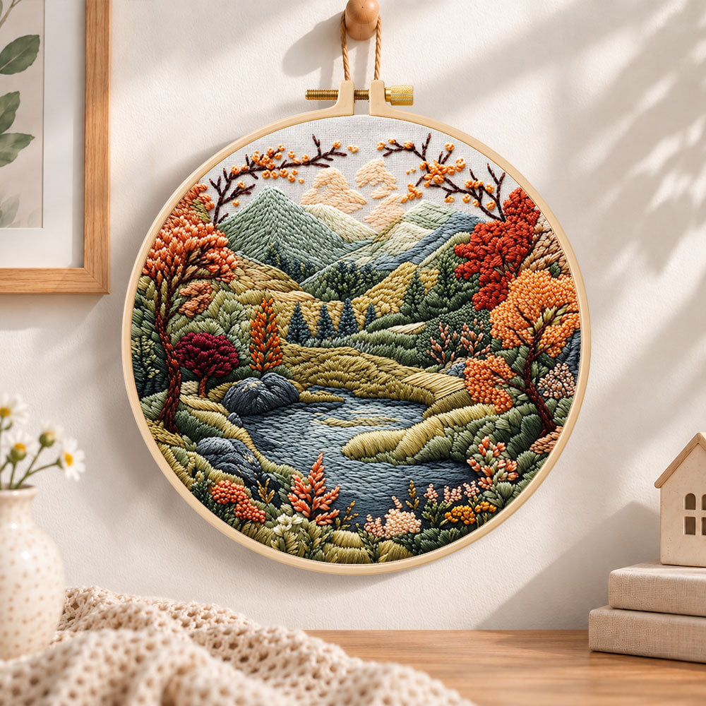 Mountain lake autumn landscape embroidery hoop wall art displayed as warm and cozy handmade home decor