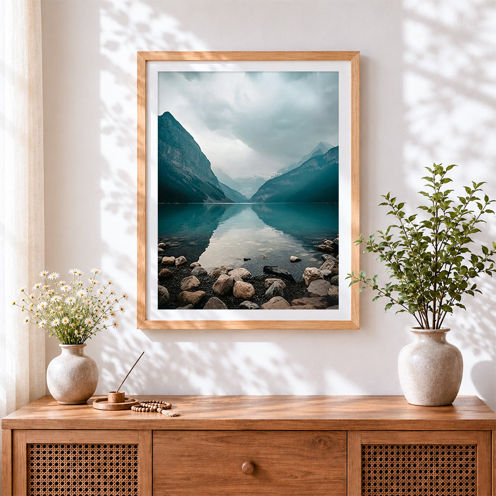 Finished mountain lake reflection cross stitch artwork displayed