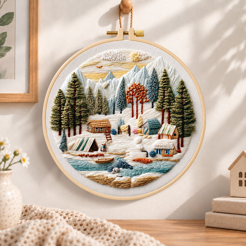 Mountain winter camp embroidery hoop wall art displayed as warm and cosy handmade home decor