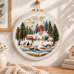 Mountain winter camp embroidery hoop wall art displayed as warm and cosy handmade home decor