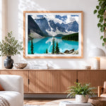 Finished mountains and turquoise lake cross stitch artwork displayed