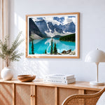Mountains and turquoise lake cross stitch artwork displayed on wall as home decor