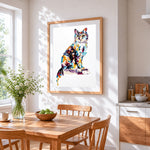 Multicoloured cat cross stitch artwork displayed on wall as home decor