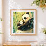 Finished mummy and baby panda in a bamboo forest cross stitch artwork displayed