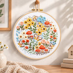 Mushroom and butterfly garden embroidery hoop wall art displayed as warm and cosy handmade home decor