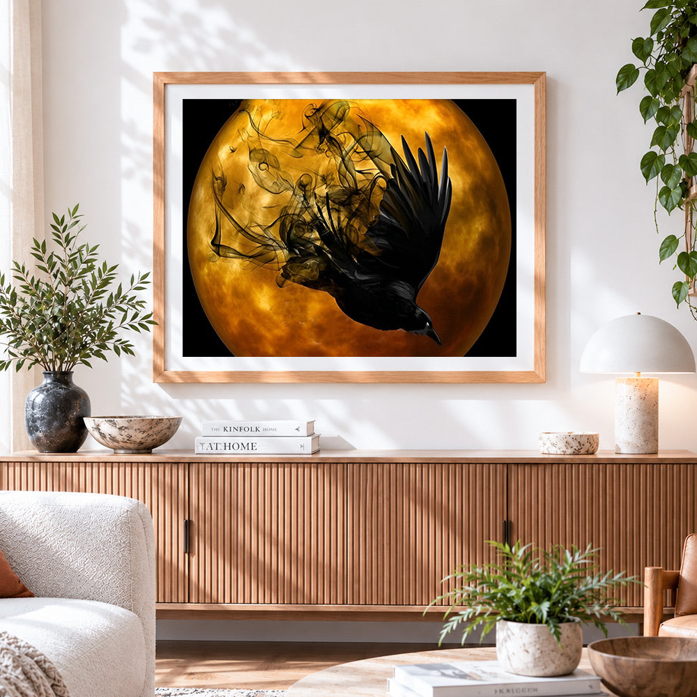 Finished mystical black raven and full moon cross stitch artwork displayed