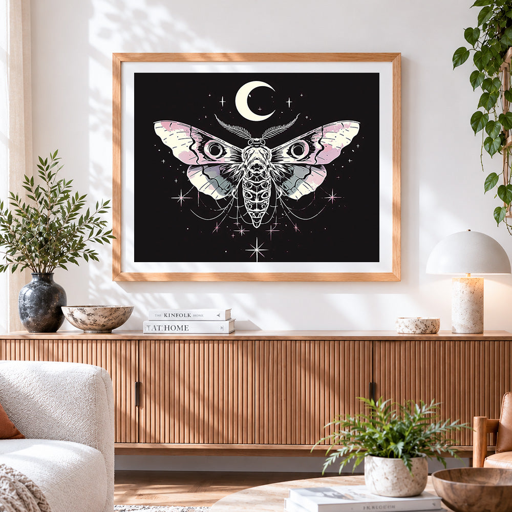 Finished mystical moth with moon and stars cross stitch artwork displayed