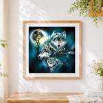 Finished mystical wolf pack under a full moon paint by numbers artwork displayed as home decor
