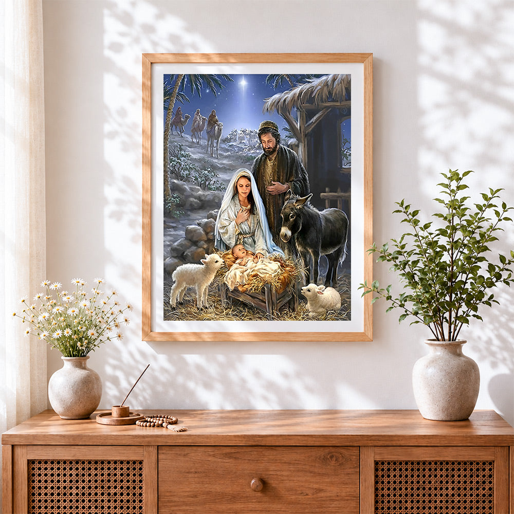 Finished nativity scene with mary, joseph and baby jesus cross stitch artwork displayed