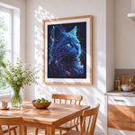 Neon blue cosmic cat cross stitch artwork displayed on wall as home decor