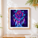 Finished neon dreamcatcher rose cross stitch artwork displayed