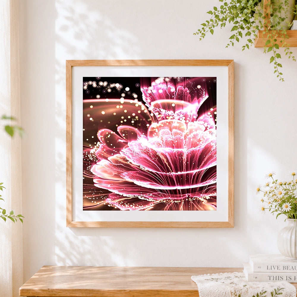 Finished neon glowing pink petals cross stitch artwork displayed