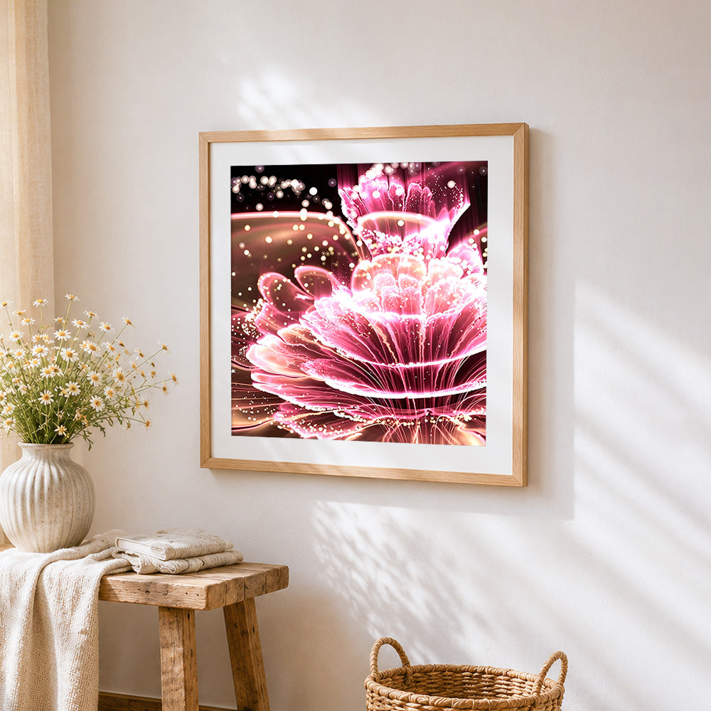 Neon glowing pink petals cross stitch artwork displayed on wall as home decor