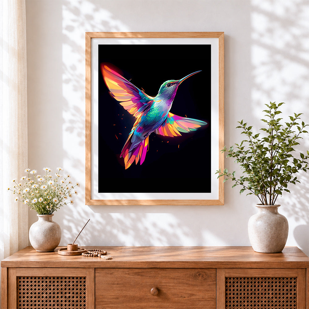 Finished neon hummingbird in flight cross stitch artwork displayed