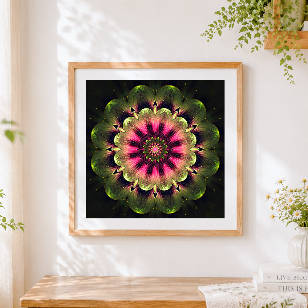 Finished neon pink and green kaleidoscope mandala cross stitch artwork displayed