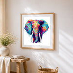 Neon pop art elephant close-up cross stitch artwork displayed on wall as home decor