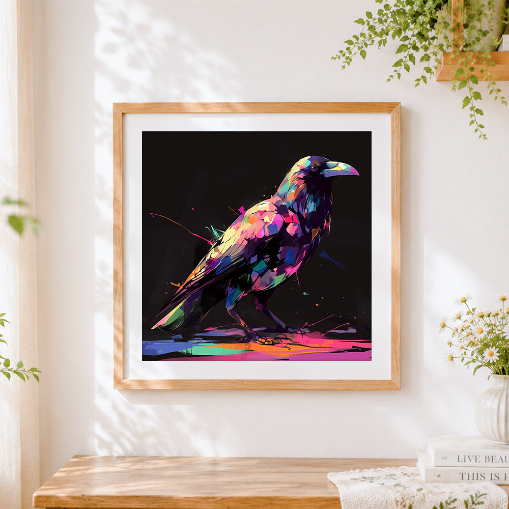 Finished neon splatter crow on black background cross stitch artwork displayed