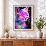 Finished neon watercolour cat cross stitch artwork displayed