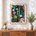 Finished night cactus garden cross stitch artwork displayed