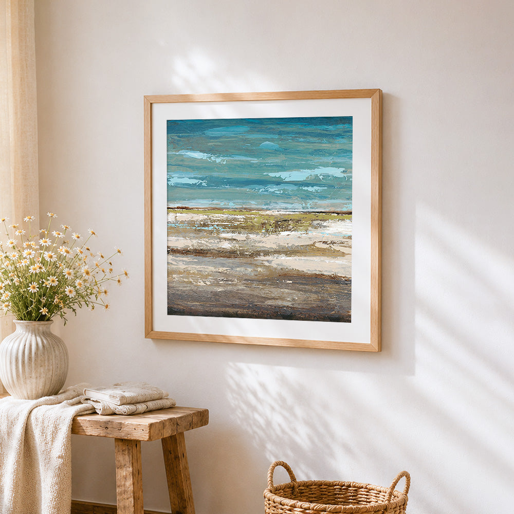 Ocean and shore cross stitch artwork displayed on wall as home decor