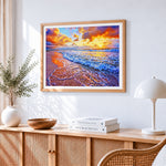 Ocean waves and beach cross stitch artwork displayed on wall as home decor