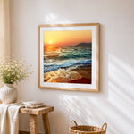 Ocean waves at sunset cross stitch artwork displayed on wall as home decor