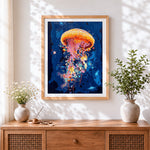 Finished orange abstract jellyfish cross stitch artwork displayed