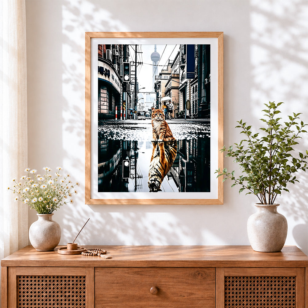 Finished orange cat and tiger reflection cross stitch artwork displayed