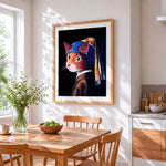 Orange cat with pearl earring cross stitch artwork displayed on wall as home decor