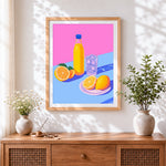 Finished orange juice, lemons and ice cross stitch artwork displayed