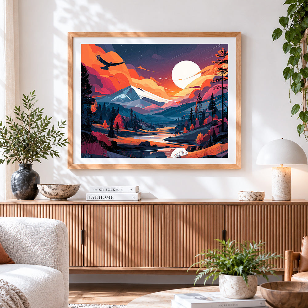 Finished orange sunset mountains cross stitch artwork displayed