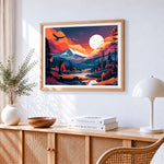 Orange sunset mountains cross stitch artwork displayed on wall as home decor