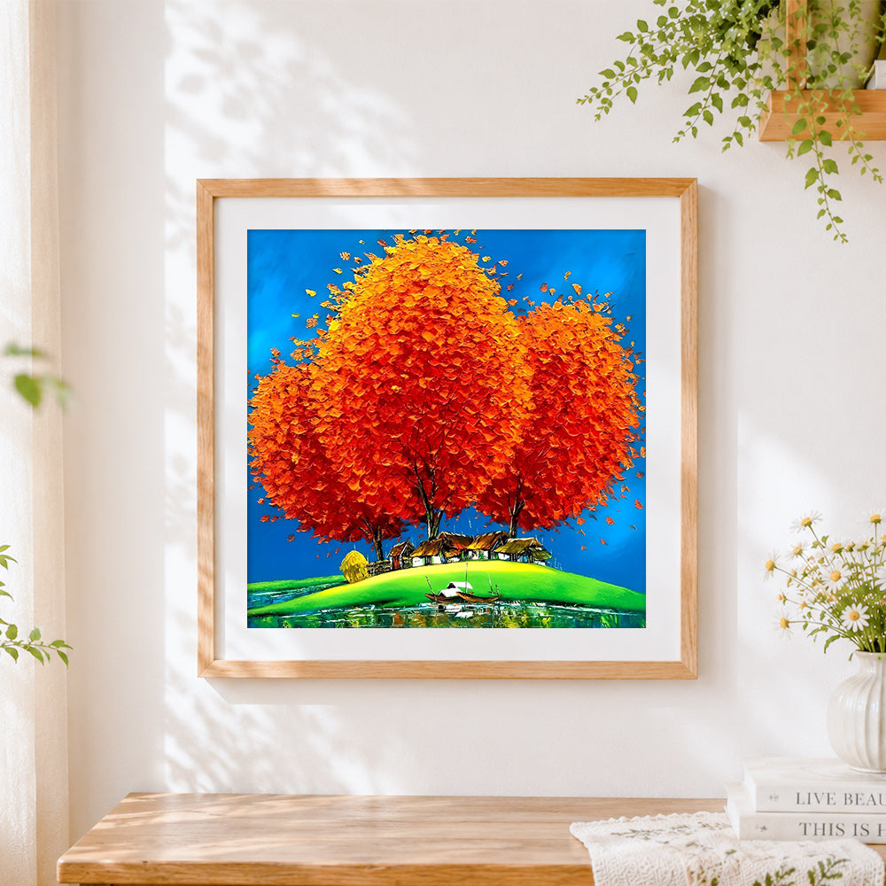 Finished orange tree and lakeside village cross stitch artwork displayed