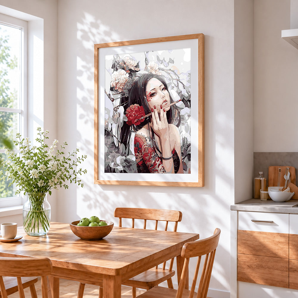 Oriental woman with tattoos and flowers cross stitch artwork displayed on wall as home decor