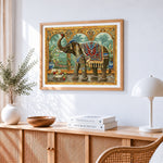 Ornate decorative elephant beside the arch cross stitch artwork displayed on wall as home decor